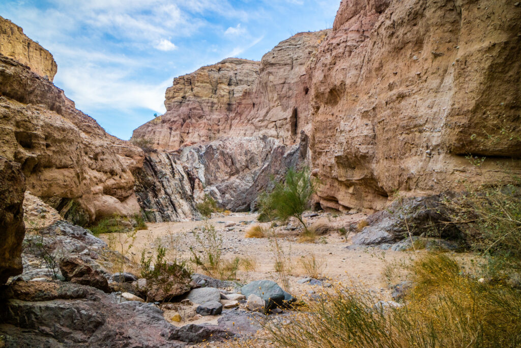 A scenic view of Painted Canyon Ladder Hike Trail in Palm Springs with rocks and canyons on the trail