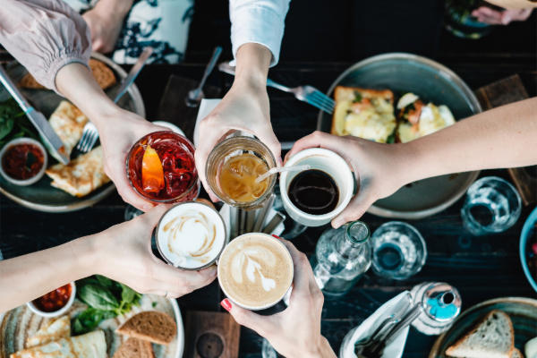 group of friends with drinks at a restaurant