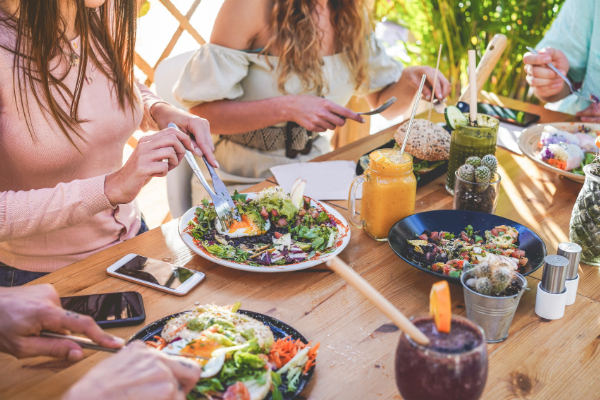 group of friends eating at restaurant