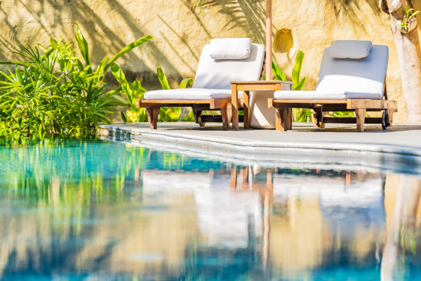 resort spa pool with lounge chairs