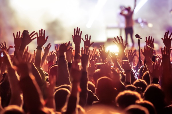 stay near indio festivals at indian palms vacation club crowd with hands in the air