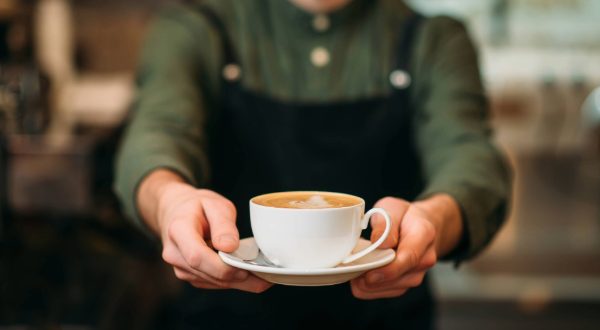 guy holding coffee